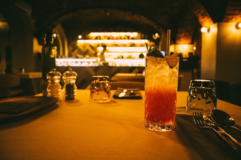 Warm restaurant bar area with ambient lighting