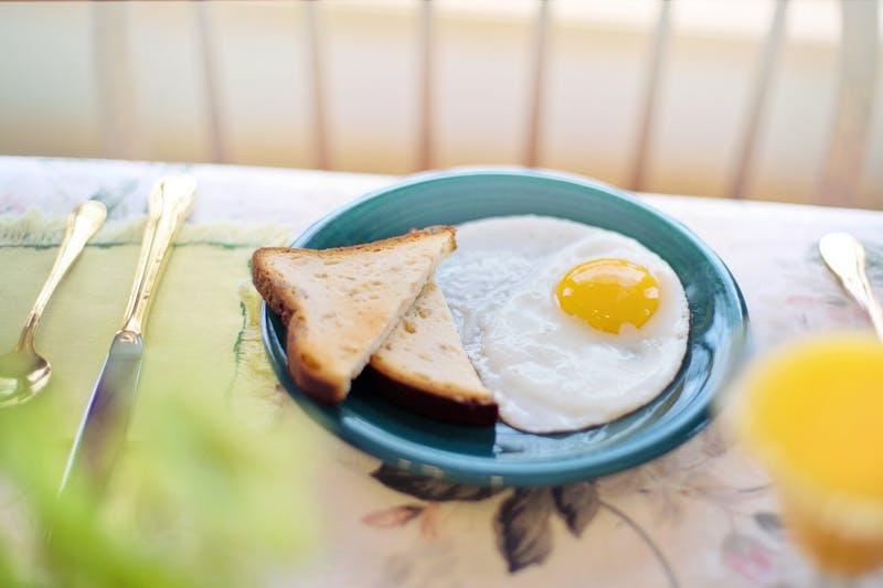 Colorful breakfast plate with eggs and toast